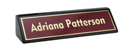 Black desk wedge with maroon nameplate.